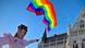 A drag queen waves a rainbow flag at an LGBT rights demonstration in front of the Hungarian parliament.