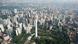 An areal view of Kuala Lumpur with many skyscrapers.